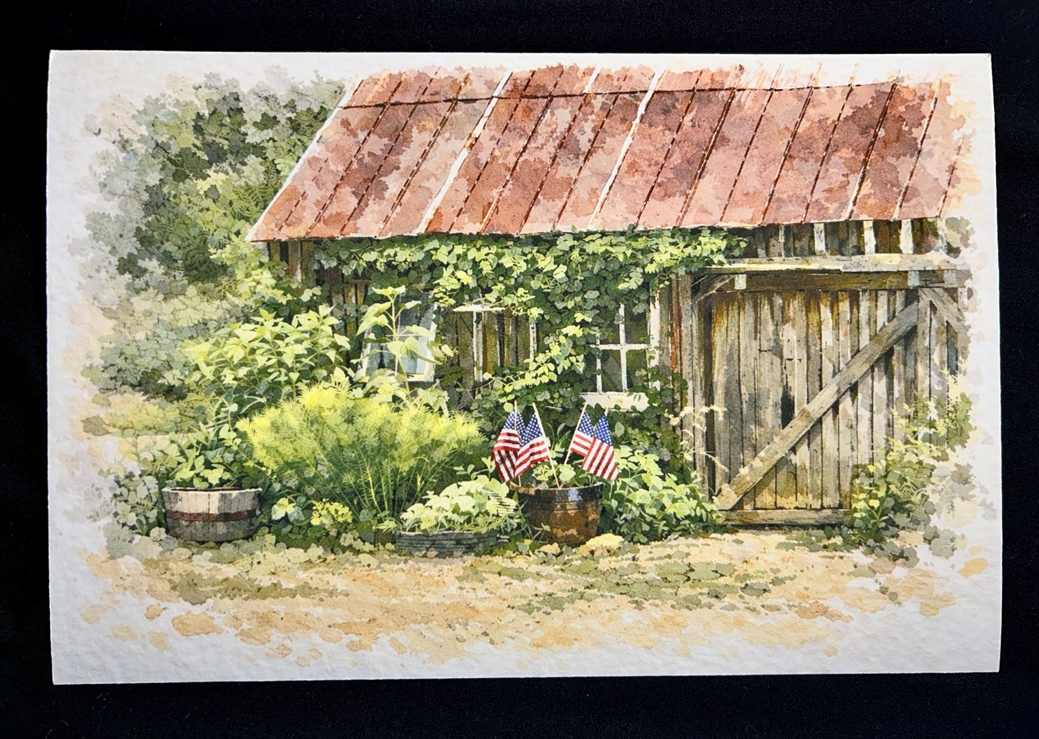 A gicl&eacute;e print of an old garden shed with a rust-red tin roof, ivy climbing the boards and small flags among the pots, printed on textured 100&percnt; cotton fiber paper.